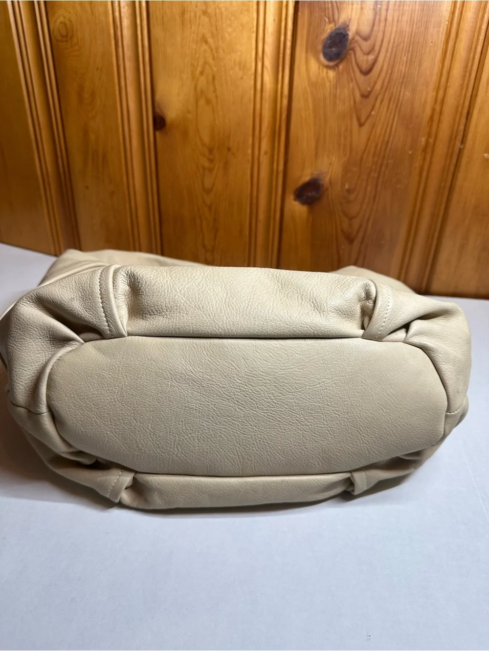 Cream Leather Shoulder Hobo Bag with Embossed Crest